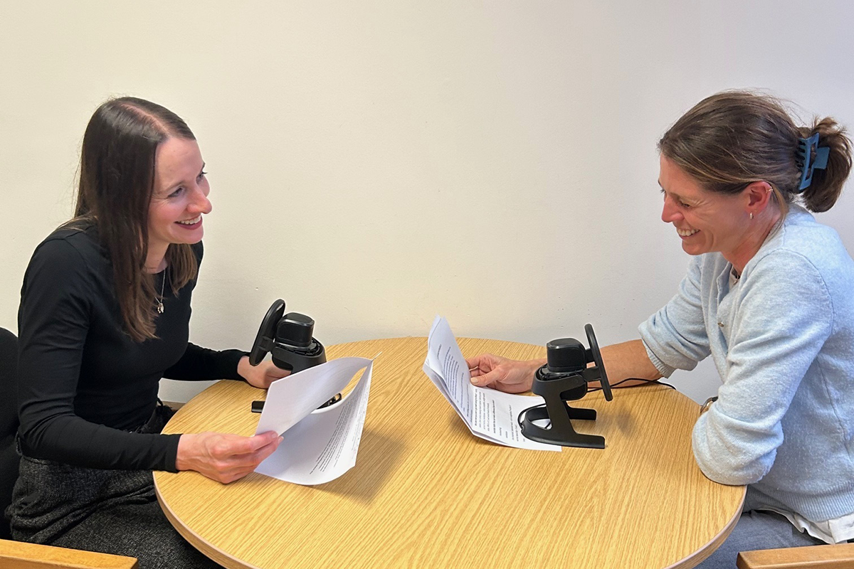 Image shows staff recording the latest episode of the podcast